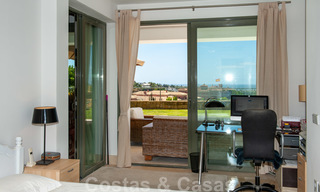 Modern front-line golf apartment with beautiful golf and sea views for sale in Los Flamingos Golf in Marbella - Benahavis 25138 