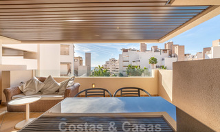 Modern apartment for sale in a frontline beach complex with sea views between Marbella and Estepona 25640 