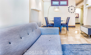 Modern garden apartment for sale in a frontline beach complex with private pool between Marbella and Estepona 25660 
