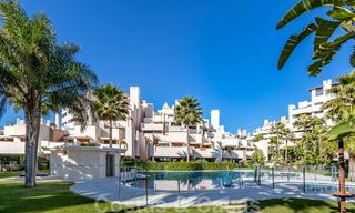 Modern garden apartment for sale in a frontline beach complex with private pool between Marbella and Estepona 25662 