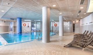 Modern garden apartment for sale in a frontline beach complex with private pool between Marbella and Estepona 25666 