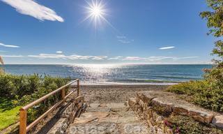 Modern garden apartment for sale in a frontline beach complex with private pool between Marbella and Estepona 25667 