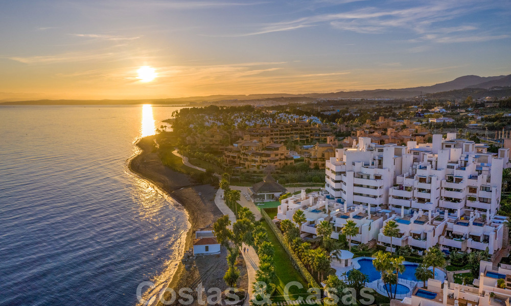 Modern garden apartment for sale in a frontline beach complex with private pool between Marbella and Estepona 25669