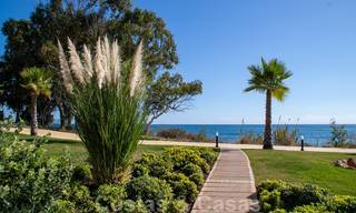 Modern garden apartment for sale in a frontline beach complex with private pool between Marbella and Estepona 25672 