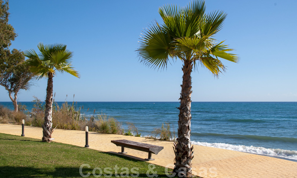 Modern garden apartment for sale in a frontline beach complex with private pool between Marbella and Estepona 25673