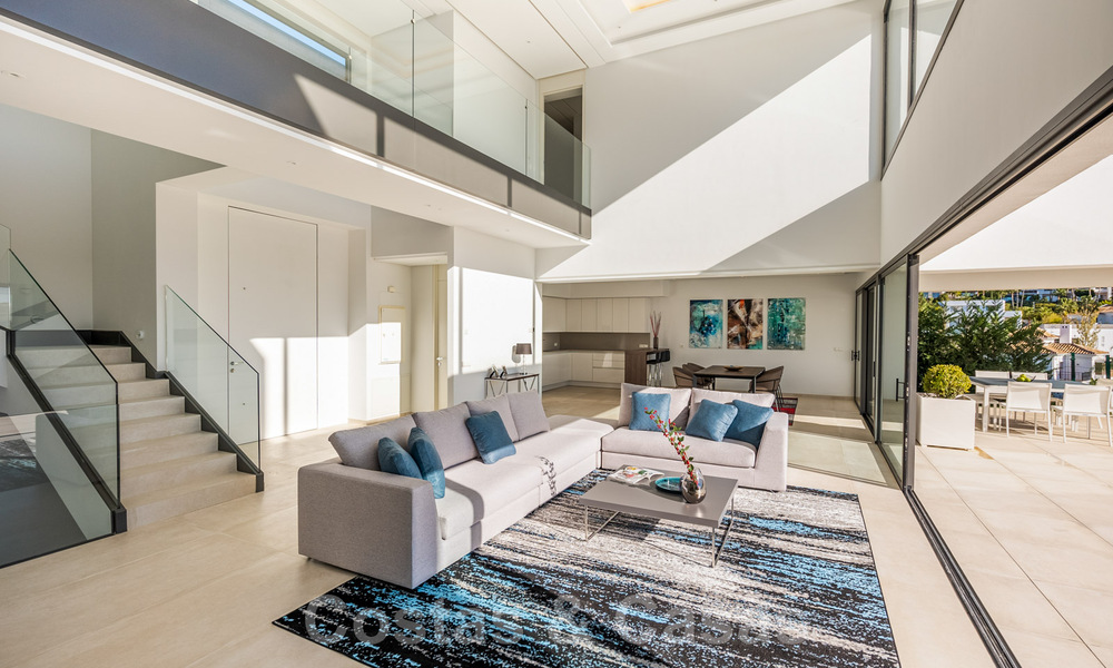 Ready to move in new luxury villa for sale, designed under a symmetrical architecture with modern lines, with golf and sea views in Marbella - Benahavis 36585