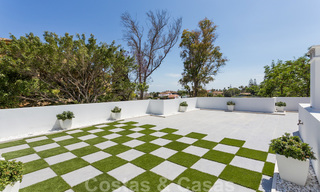 First line golf and a stone's throw from the beach located designer villa for sale in the chic Guadalmina Baja in Marbella 26355 