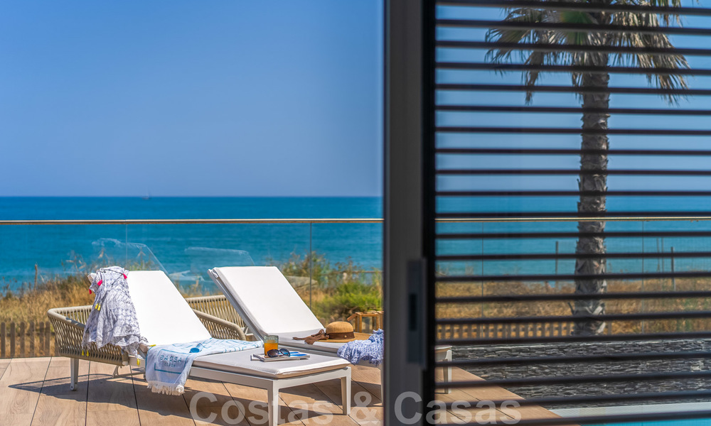 Ready to move in modern luxury front line beach villa for sale in an exclusive complex in Estepona, Costa del Sol 28219