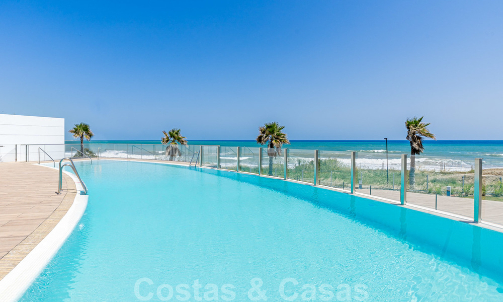 Ready to move in modern luxury front line beach villa for sale in an exclusive complex in Estepona, Costa del Sol 28230