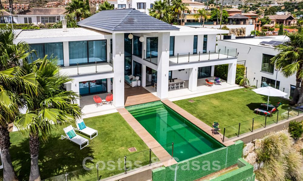 Modern villa for sale, frontline golf with panoramic mountain, golf and sea views in Benahavis - Marbella 42260