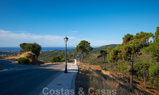 Building plots for sale with panoramic sea and mountain views on a luxury estate in Marbella - Benahavis 32268 