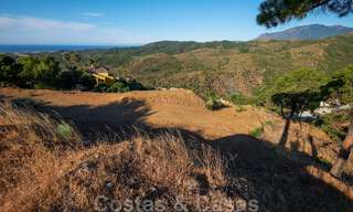 Building plots for sale with panoramic sea and mountain views on a luxury estate in Marbella - Benahavis 32273 