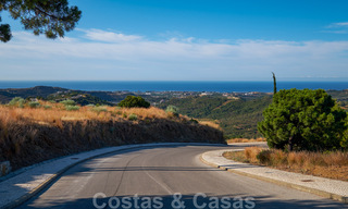Building plots for sale with panoramic sea and mountain views on a luxury estate in Marbella - Benahavis 32277 