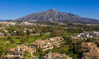 Spacious luxury penthouse with panoramic views for sale on a golf course in Nueva Andalucia, Marbella 32092 