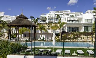 Modern 3-bedroom apartment for sale with partial sea view in a front-line golf complex in Benahavis - Marbella 32557 