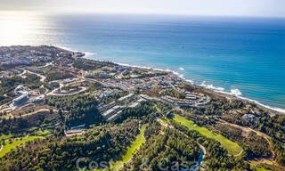 Stunning new avant-garde design terrace houses with sea views for sale in a prestigious golf resort in Mijas Costa, Costa del Sol 32661 