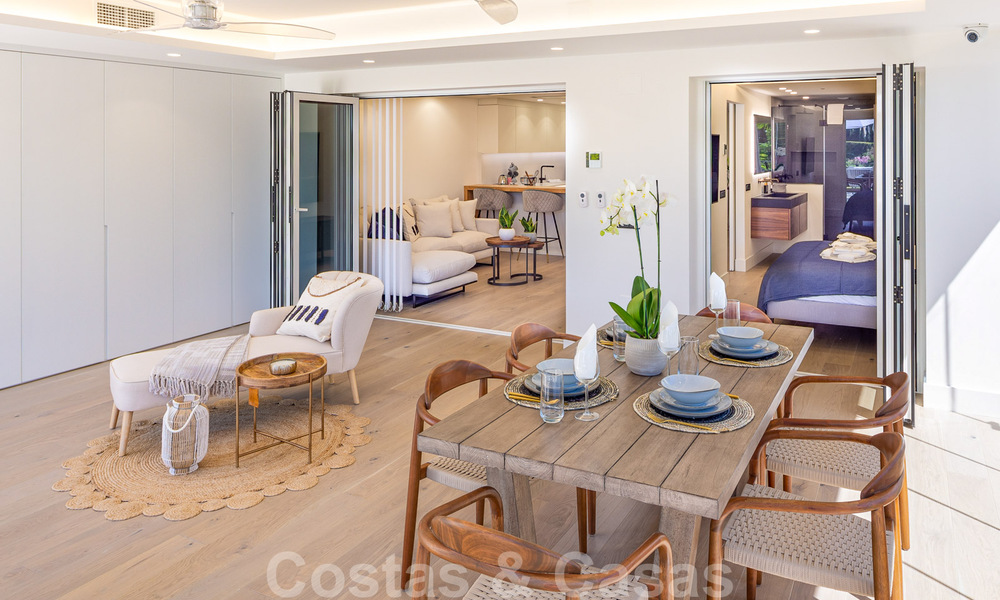 Stunning contemporary refurbished south facing luxury garden flat for sale in Nueva Andalucia, Marbella 32860