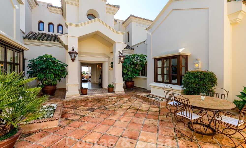 Luxury villa for sale in a classic Mediterranean style with lovely sea views in a gated community on the Golden Mile, Marbella 33011