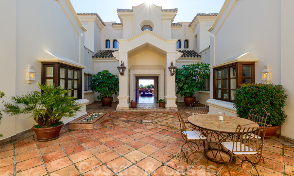 Luxury villa for sale in a classic Mediterranean style with lovely sea views in a gated community on the Golden Mile, Marbella 33012