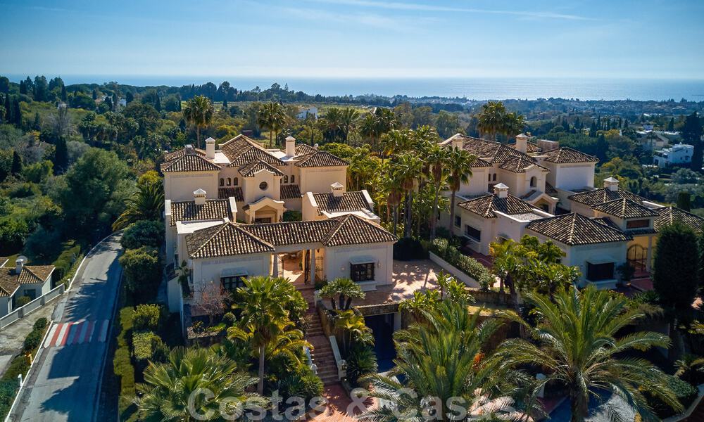 Two side-by-side luxury villas for sale on one property built in a classic Mediterranean style with stunning panoramic sea views in a gated community on the Golden Mile, Marbella 33053