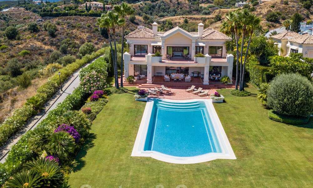 Two side-by-side luxury villas for sale on one property built in a classic Mediterranean style with stunning panoramic sea views in a gated community on the Golden Mile, Marbella 33054