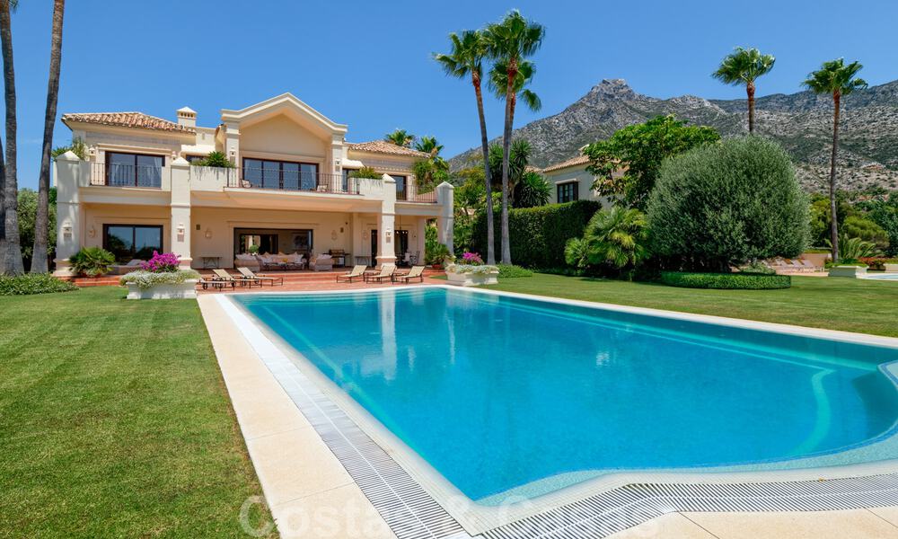 Two side-by-side luxury villas for sale on one property built in a classic Mediterranean style with stunning panoramic sea views in a gated community on the Golden Mile, Marbella 33057