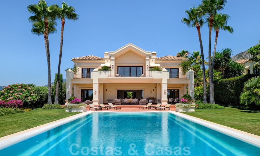 Two side-by-side luxury villas for sale on one property built in a classic Mediterranean style with stunning panoramic sea views in a gated community on the Golden Mile, Marbella 33068