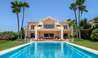 Two side-by-side luxury villas for sale on one property built in a classic Mediterranean style with stunning panoramic sea views in a gated community on the Golden Mile, Marbella 33068 