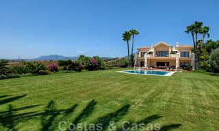 Two side-by-side luxury villas for sale on one property built in a classic Mediterranean style with stunning panoramic sea views in a gated community on the Golden Mile, Marbella 33069 