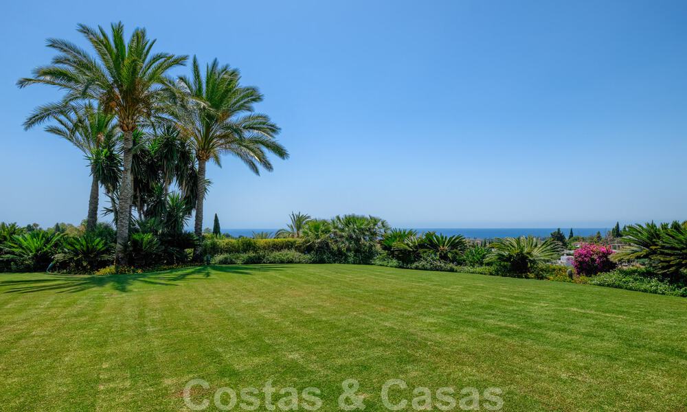 Two side-by-side luxury villas for sale on one property built in a classic Mediterranean style with stunning panoramic sea views in a gated community on the Golden Mile, Marbella 33071