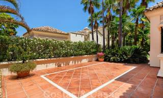 Two side-by-side luxury villas for sale on one property built in a classic Mediterranean style with stunning panoramic sea views in a gated community on the Golden Mile, Marbella 33079 
