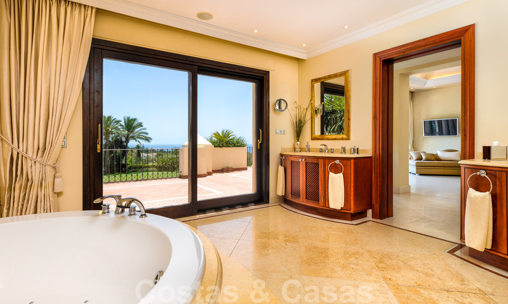 Two side-by-side luxury villas for sale on one property built in a classic Mediterranean style with stunning panoramic sea views in a gated community on the Golden Mile, Marbella 33085