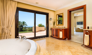 Two side-by-side luxury villas for sale on one property built in a classic Mediterranean style with stunning panoramic sea views in a gated community on the Golden Mile, Marbella 33085 