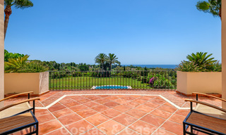 Two side-by-side luxury villas for sale on one property built in a classic Mediterranean style with stunning panoramic sea views in a gated community on the Golden Mile, Marbella 33088 