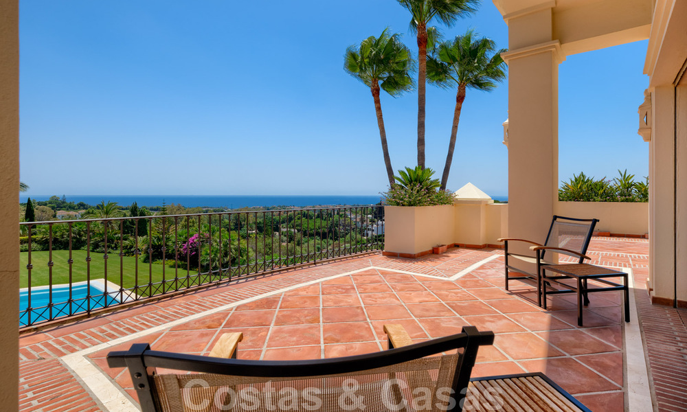 Two side-by-side luxury villas for sale on one property built in a classic Mediterranean style with stunning panoramic sea views in a gated community on the Golden Mile, Marbella 33092