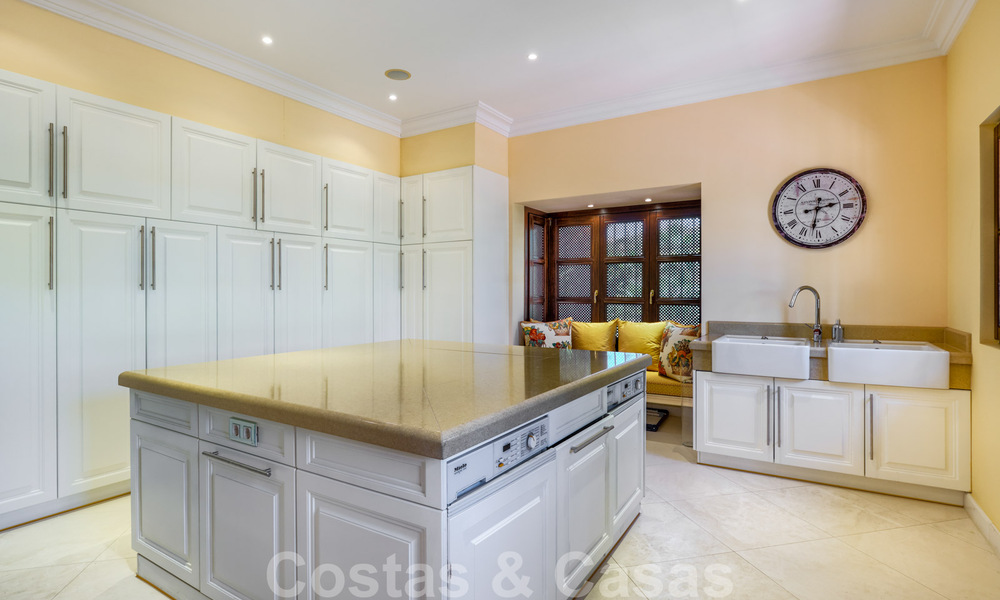 Two side-by-side luxury villas for sale on one property built in a classic Mediterranean style with stunning panoramic sea views in a gated community on the Golden Mile, Marbella 33096