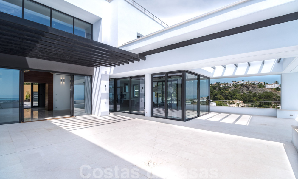 Exclusive and high-tech modern style villa with panoramic sea views for sale, in a prestigious urbanization in Benahavis - Marbella. Completed. 34389