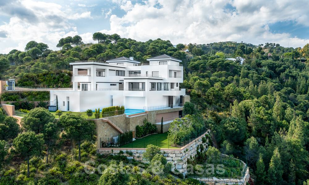 Exclusive and high-tech modern style villa with panoramic sea views for sale, in a prestigious urbanization in Benahavis - Marbella. Completed. 34437