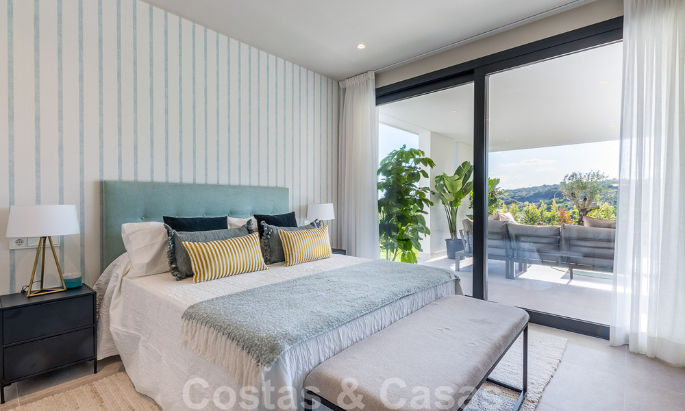 New development with luxury apartments for sale offering panoramic views to the sea and a golf course in Estepona 37435