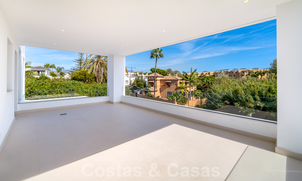 Very affordable, new, ready to move in, modern, beachside villa for sale on the New Golden Mile between Marbella and Estepona, just steps from the beach 38611