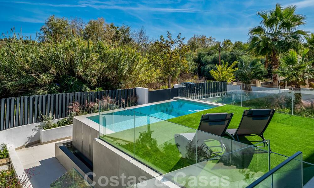 Very affordable, new, ready to move in, modern, beachside villa for sale on the New Golden Mile between Marbella and Estepona, just steps from the beach 38894