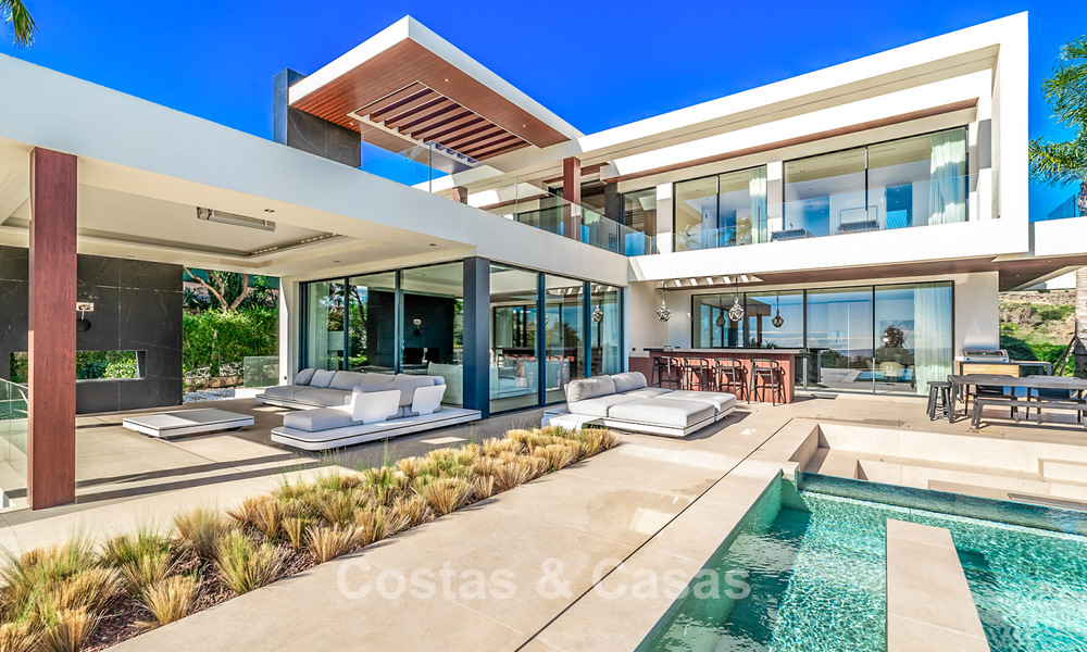 Modern, architectural villa with panoramic sea views for sale in a five star golf resort in Marbella - Benahavis 791732