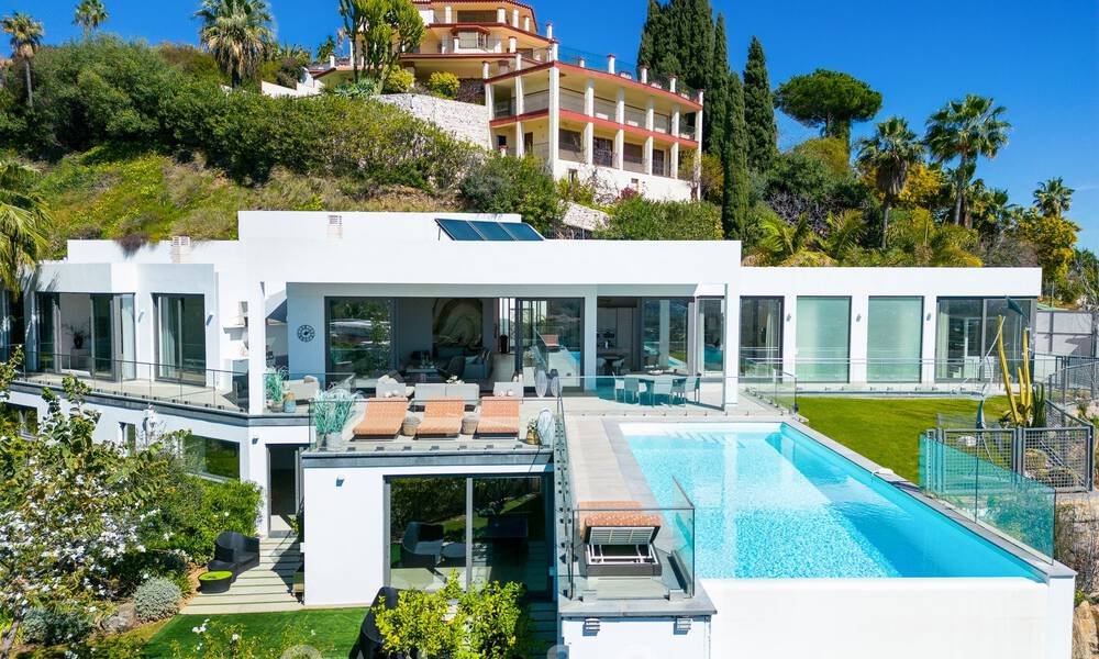 Spacious, architectural villa for sale with spectacular open sea views in a private community in Benahavis - Marbella 52160