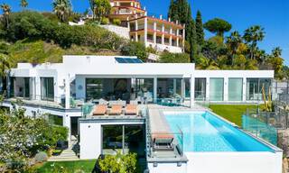 Spacious, architectural villa for sale with spectacular open sea views in a private community in Benahavis - Marbella 52160 