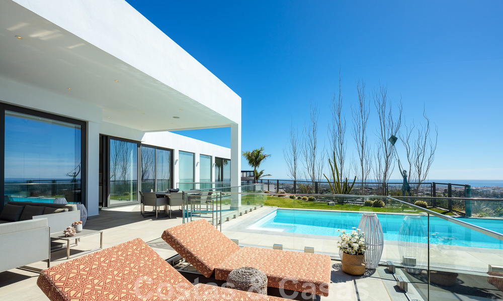 Spacious, architectural villa for sale with spectacular open sea views in a private community in Benahavis - Marbella 52170