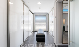 Avant-garde beach villa in a sleek modern style for sale, frontline beach in Mijas Costa, Costa del Sol 44437 
