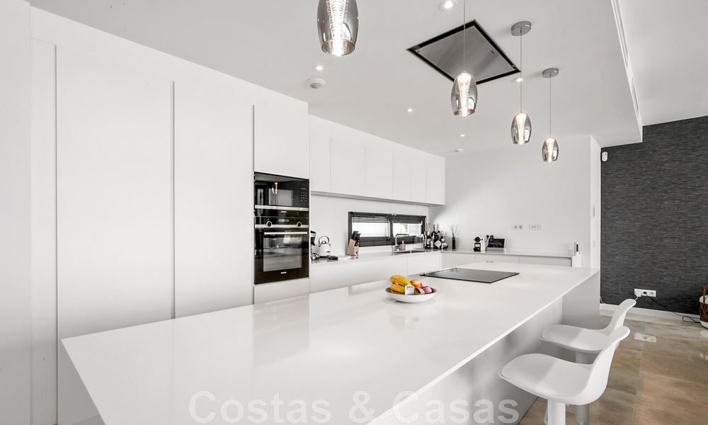 Move-in ready, contemporary villa for sale with sea views, in a gated villa development on the border of Mijas and Marbella 46087
