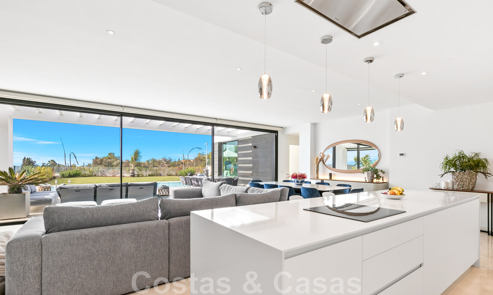 Move-in ready, contemporary villa for sale with sea views, in a gated villa development on the border of Mijas and Marbella 46090
