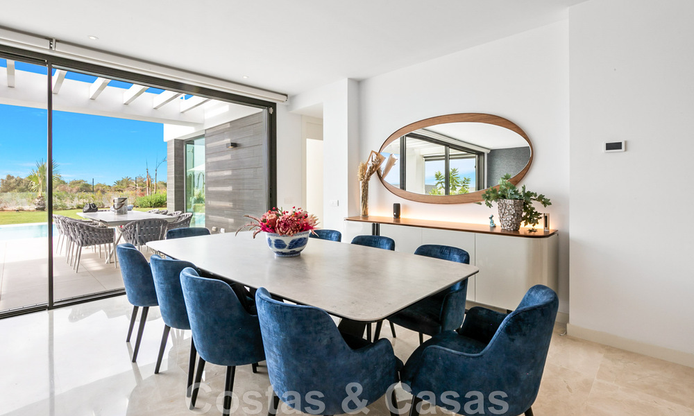 Move-in ready, contemporary villa for sale with sea views, in a gated villa development on the border of Mijas and Marbella 46094