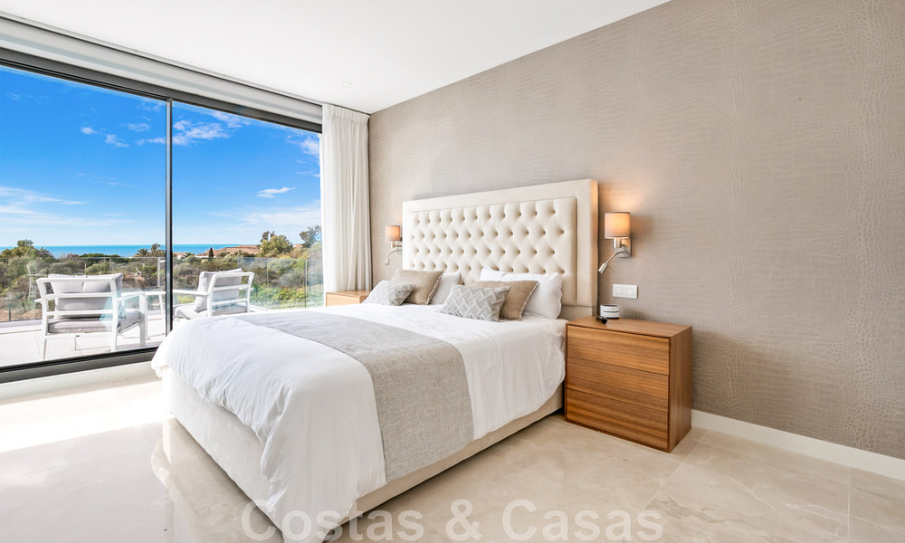 Move-in ready, contemporary villa for sale with sea views, in a gated villa development on the border of Mijas and Marbella 46106